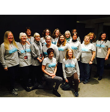 Mountain Melody Chorus group photo wearing tee shirts
