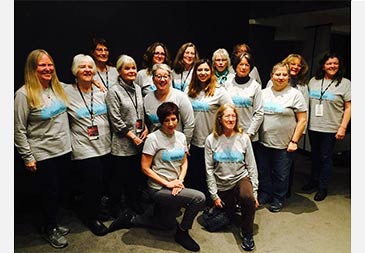 Mountain Melody Chorus group photo wearing tee shirts